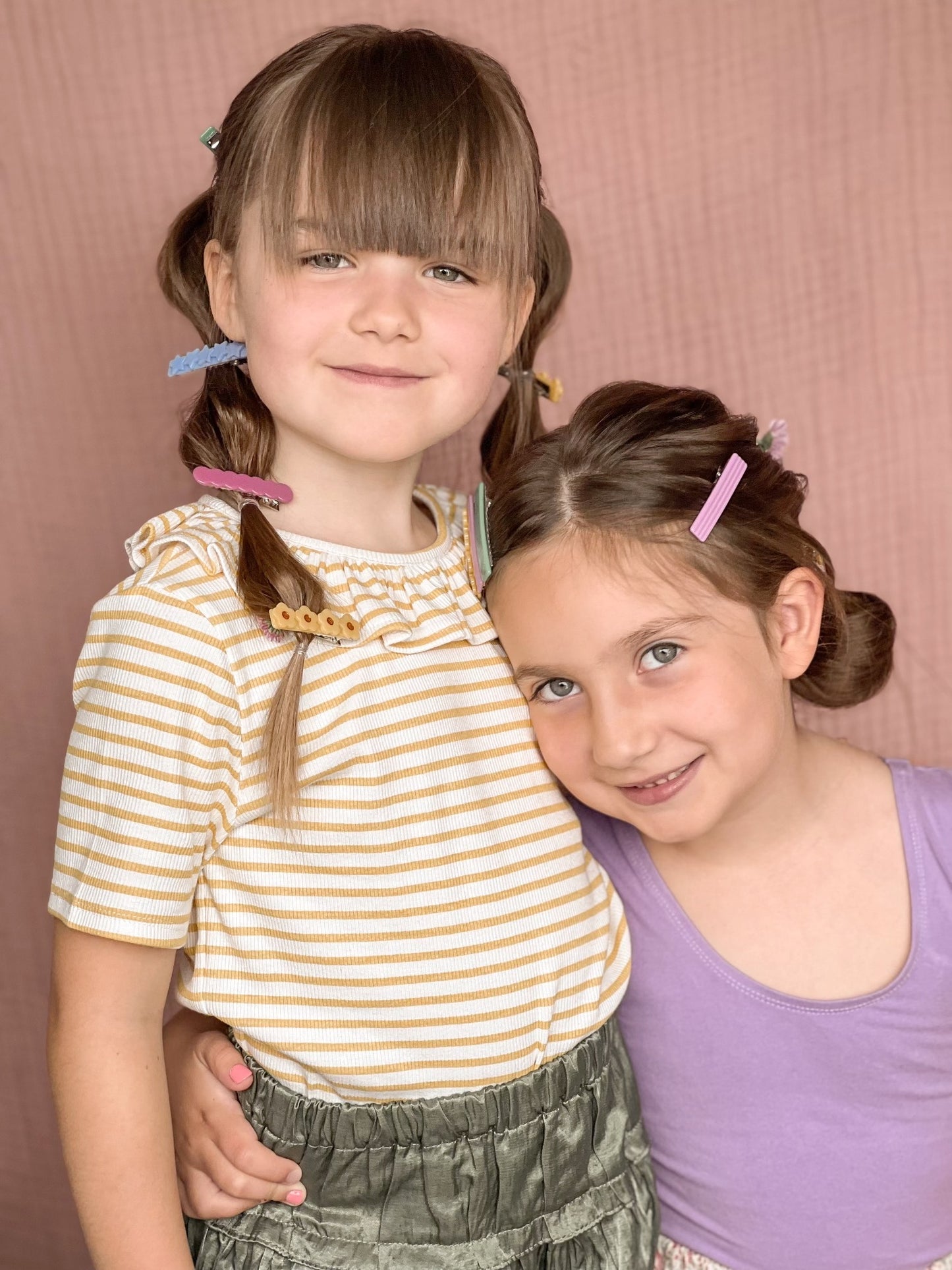 two little friends with lots of colorful hair clips!