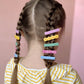 little girl hair style, two dutch french braids with cute and colorful hair clips from bloom and play.