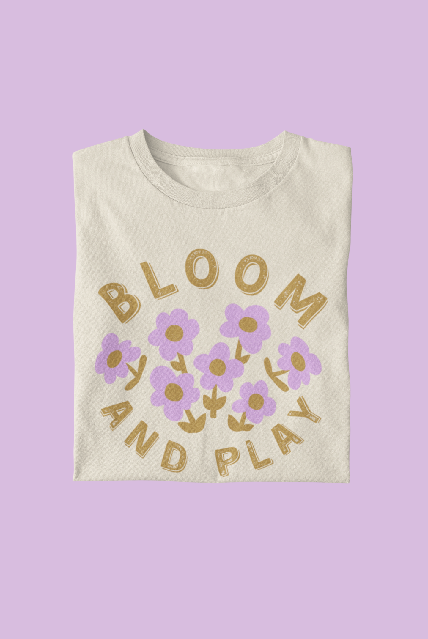 Toddler graphic tee with playful 'Bloom and Play' lilac flowers - Available in sizes 2T to 5T - Embrace childhood fun with this whimsical design.