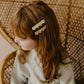 hair clips, green flower clip, pink flower clip on red hair